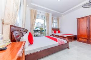 Postel nebo postele na pokoji v ubytování OYO 446 The Bao Hotel