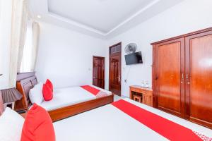 Postel nebo postele na pokoji v ubytování OYO 446 The Bao Hotel