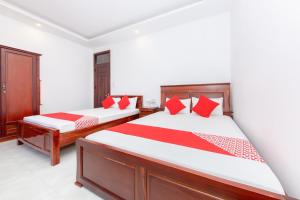 Postel nebo postele na pokoji v ubytování OYO 446 The Bao Hotel