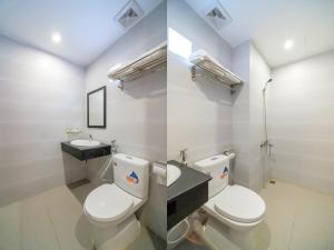 A bathroom at Capital O 215 An Duc Hotel Da Nang