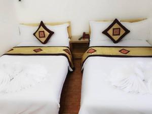 Postel nebo postele na pokoji v ubytování OYO 1143 Thu Giang Hotel