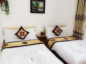 Postel nebo postele na pokoji v ubytování OYO 1143 Thu Giang Hotel