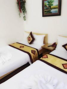 Postel nebo postele na pokoji v ubytování OYO 1143 Thu Giang Hotel