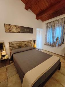 Postel nebo postele na pokoji v ubytování B&B Flavio e Catia
