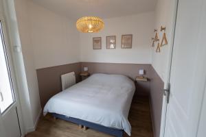 Katil atau katil-katil dalam bilik di Appartement rénové à 200m de la mer