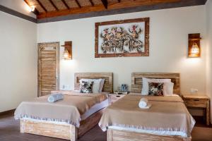 Postel nebo postele na pokoji v ubytování The Asri Villas + 17 fotografií