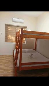 Postel nebo postele na pokoji v ubytování Hideaway Camiguin Homestay