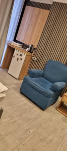 a blue couch and a chair in a room at The my hotel darica in Darıca