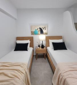 A bed or beds in a room at Hotel Andreas - Agistri (Skala)