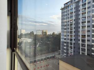 a view of a city street from a window at Zen Haven Lavington in Nairobi