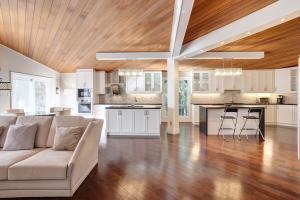 a large living room with a couch and a kitchen at Joyful Mansion with Charm Indoor in Mississauga