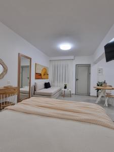 A bed or beds in a room at Hotel Andreas - Agistri (Skala)