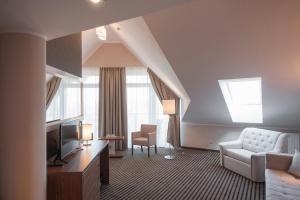 TV a/nebo společenská místnost v ubytování Hotel White