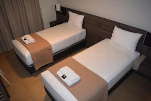 Letto o letti in una camera di Hotel Mega