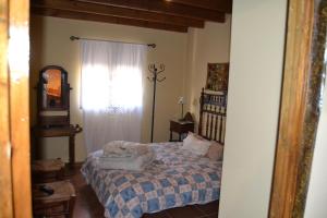 a bedroom with a bed and a window at Cerro del tendero in Fuente del Arco +27 photos