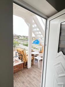 a view from the door of a patio with a table and chairs at Apartments by Arbri 2 in Vlorë