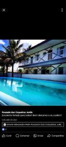 ein Screenshot einer Website eines Gebäudes mit Pool in der Unterkunft Pousada dos Coqueiros in Água Boa