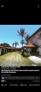 ein Screenshot einer Website eines Gebäudes mit einer Palme in der Unterkunft Pousada dos Coqueiros in Água Boa