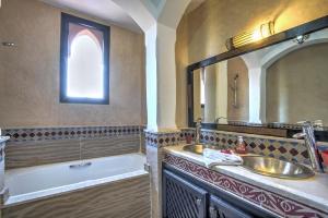 a bathroom with a sink and a tub and a mirror at VILLA Garden in Marrakesh +15 photos