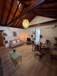 a living room with a couch and a table at Balcón Néstor Álamo II in Tejeda +29 photos