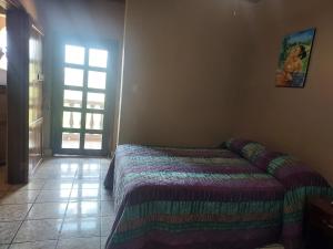 Postel nebo postele na pokoji v ubytování Hotel La Escalinata