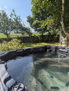 a large pool of water in a backyard at Laythams Holiday Lets Retreat in Slaidburn +33 photos