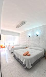 Postelja oz. postelje v sobi nastanitve Hotel Qamiri