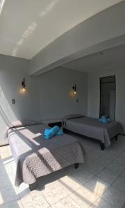 Postelja oz. postelje v sobi nastanitve Hotel Qamiri