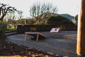 a bench and a table on the ground at Lodge-Style Retreat 10 Acres King Beds in Sedro-Woolley
