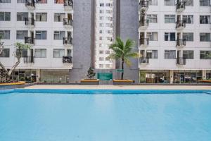 Πισίνα στο ή κοντά στο OYO Life 92649 Jarrdin Apartment By Glory