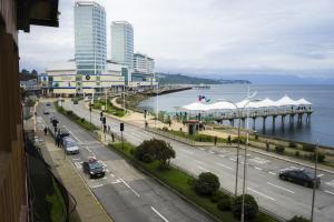 a view of a city with a pier and the water at Gran Hotel Vicente Costanera in Puerto Montt +60 photos