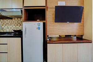 Η κουζίνα ή μικρή κουζίνα στο OYO Life Apartement Jarrdin By Fins Property