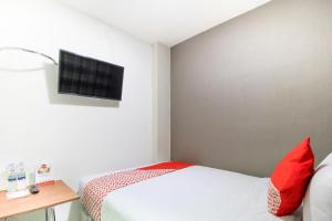 Postel nebo postele na pokoji v ubytování Super OYO Capital O 217 A1 Hotel + 19 fotografií