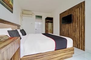 Postel nebo postele na pokoji v ubytování SUPER OYO Collection O 92277 Setra Priangan Guest House
