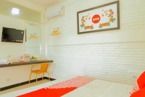 TV a/nebo společenská místnost v ubytování OYO 354' 32 Guest House