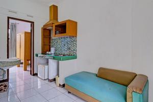 Kuchyň nebo kuchyňský kout v ubytování Super OYO Capital O 91810 Hotel Balebat 2