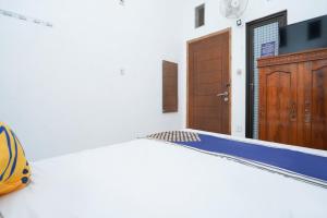 Letto o letti in una camera di SPOT ON 2479 Berkah Residence Syariah