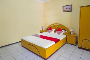 Postel nebo postele na pokoji v ubytování OYO 1984 Hotel Istana Family Syariah + 26 fotografií