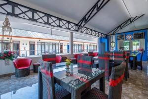 Restoran või mõni muu söögikoht majutusasutuses OYO Collection O 1032 Rahayu Residence Syariah