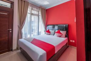 Voodi või voodid majutusasutuse OYO Collection O 1032 Rahayu Residence Syariah toas
