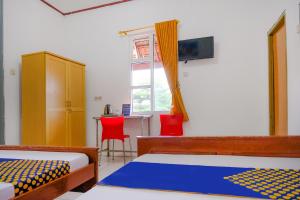 TV a/nebo společenská místnost v ubytování OYO Life 2638 Hotel Raya