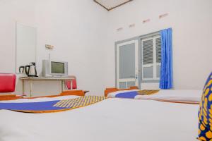 Kuchyň nebo kuchyňský kout v ubytování OYO Life 2638 Hotel Raya