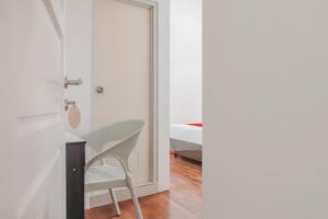 Postel nebo postele na pokoji v ubytování Super OYO Capital O 90342 Kemang Garden