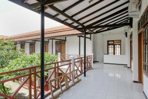 an external view of the balcony of a house at Hotel O Kina Family Residence Syariah in Malang