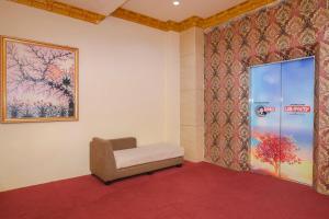 Postel nebo postele na pokoji v ubytování Capital O 854 Ub Caisar Hotel + 28 fotografií