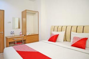 Postel nebo postele na pokoji v ubytování Hotel O M Authentic Kost Man