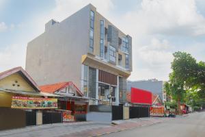 a building on the side of a street at OYO Life 1830 Mandala Residence in Jakarta