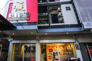 a store front of a building with a sign on it at Hotel O Manado near Gereja Advent Tikala Baru formerly Rid's Hotel in Manado