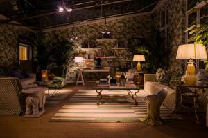 a living room with a couch and a table at Hotel Van Cleef in Bruges
