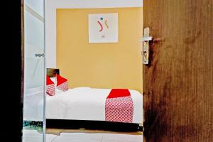 Posteľ alebo postele v izbe v ubytovaní Super OYO 90692 Point Hostel
